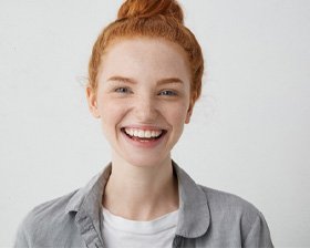 woman smiling after getting veneers