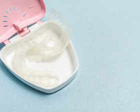 Upper and lower mouthguard sitting in a case