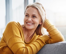 a woman with dentures enjoying a comfortable smile