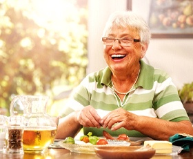 Woman smiling with dentures in Downtown Washington DC