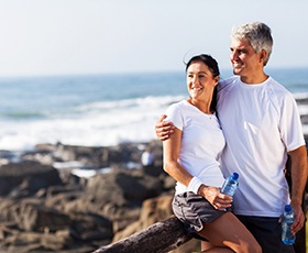 couple enjoying the benefits of dental implants in Washington DC