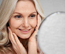 woman enjoying the benefits of dental implants in Washington DC