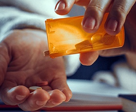 Closeup of medication to take after dental implant surgery in Washington, DC