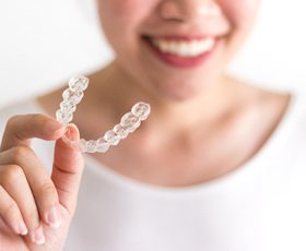Woman with clear aligner