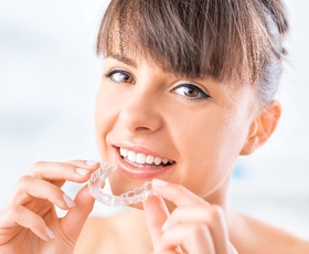 Woman with clear aligner