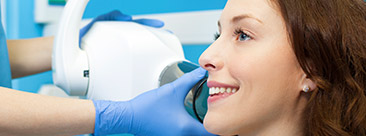 Woman receiving digital dental x-rays