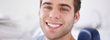 Smiling man in dental chair