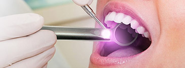 Patient receiving oral cancer screening