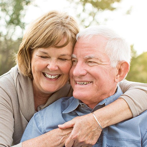 Senior man and woman smiling together