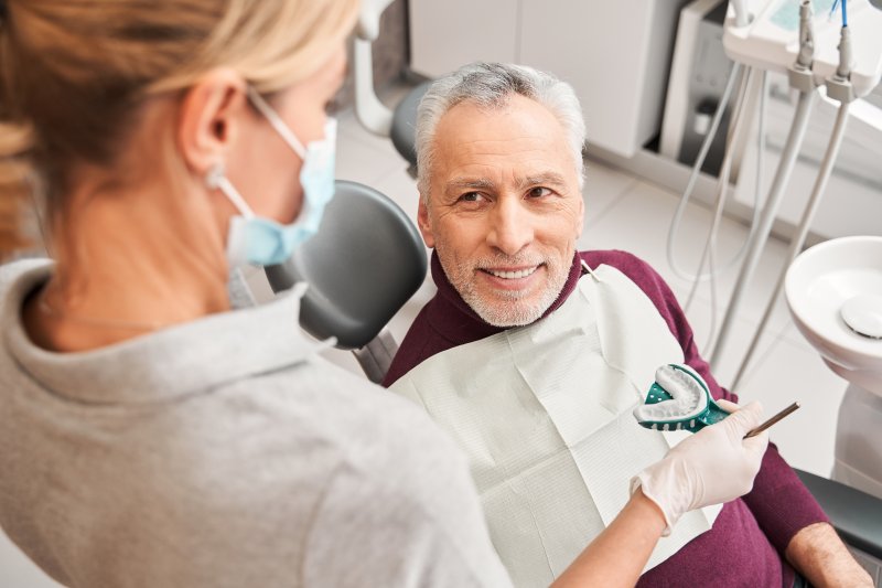 Man smiling at woman